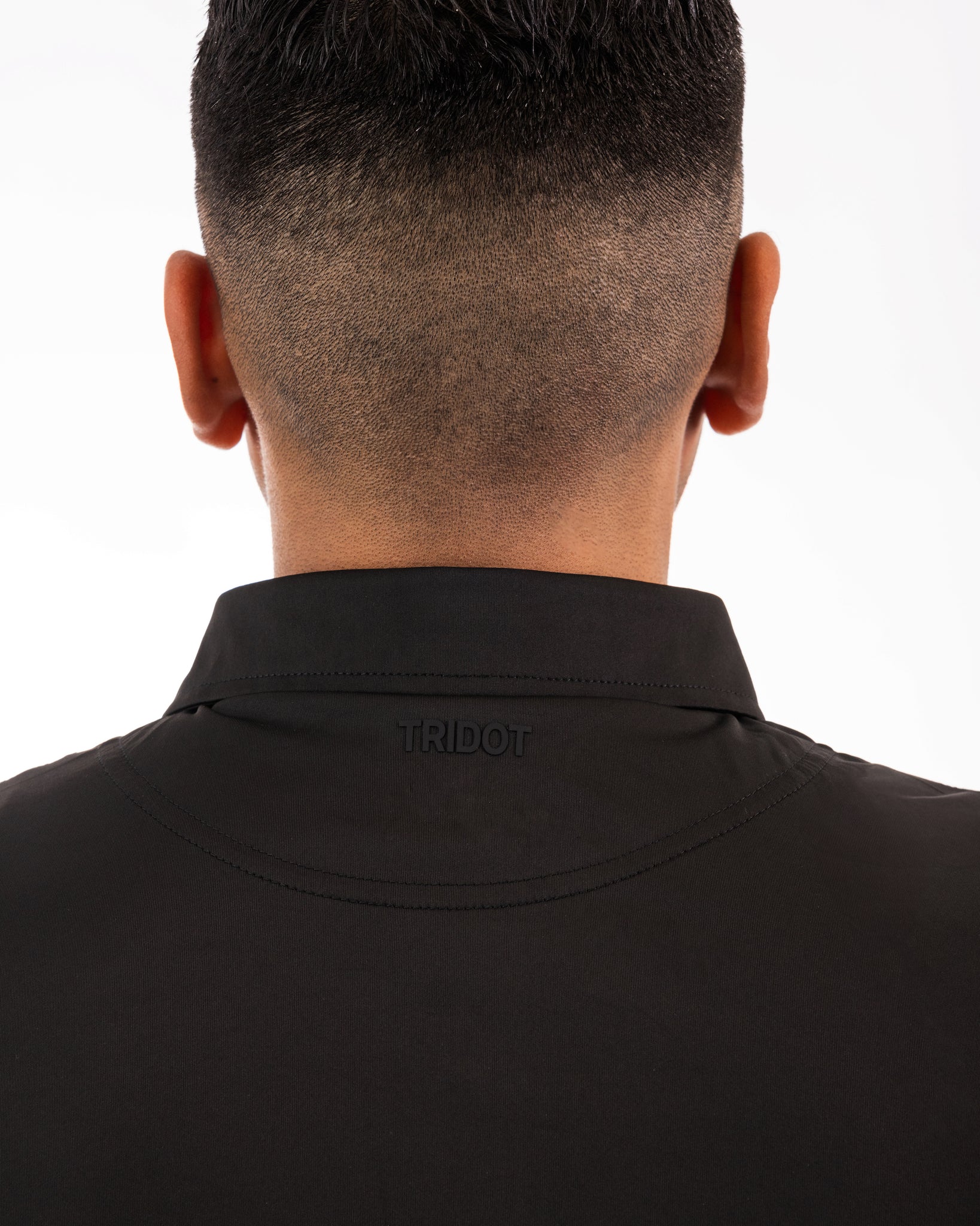 This is a classy golf polo that is jet black all around. It’s breathable, uv protected, 4-way stretch and an athletic fit.