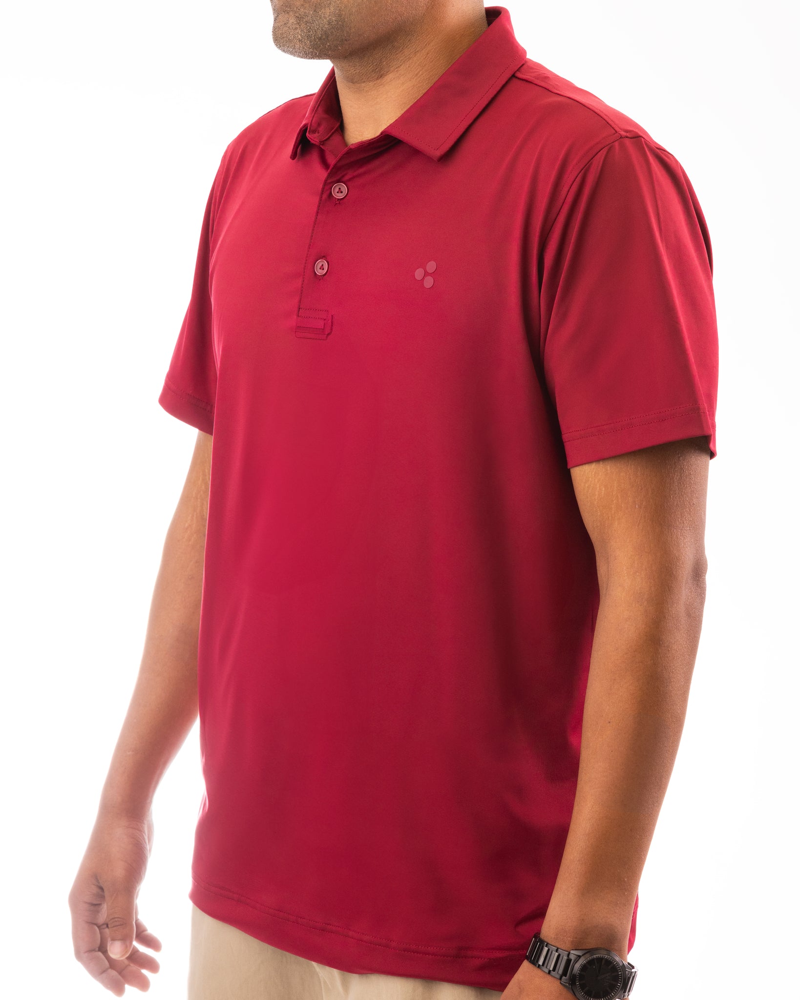 A golf polo that is dark red, like blood, this polo is high performing. It has 4-way stretch, wicks moisture, has an athletic fit and is breathable. 