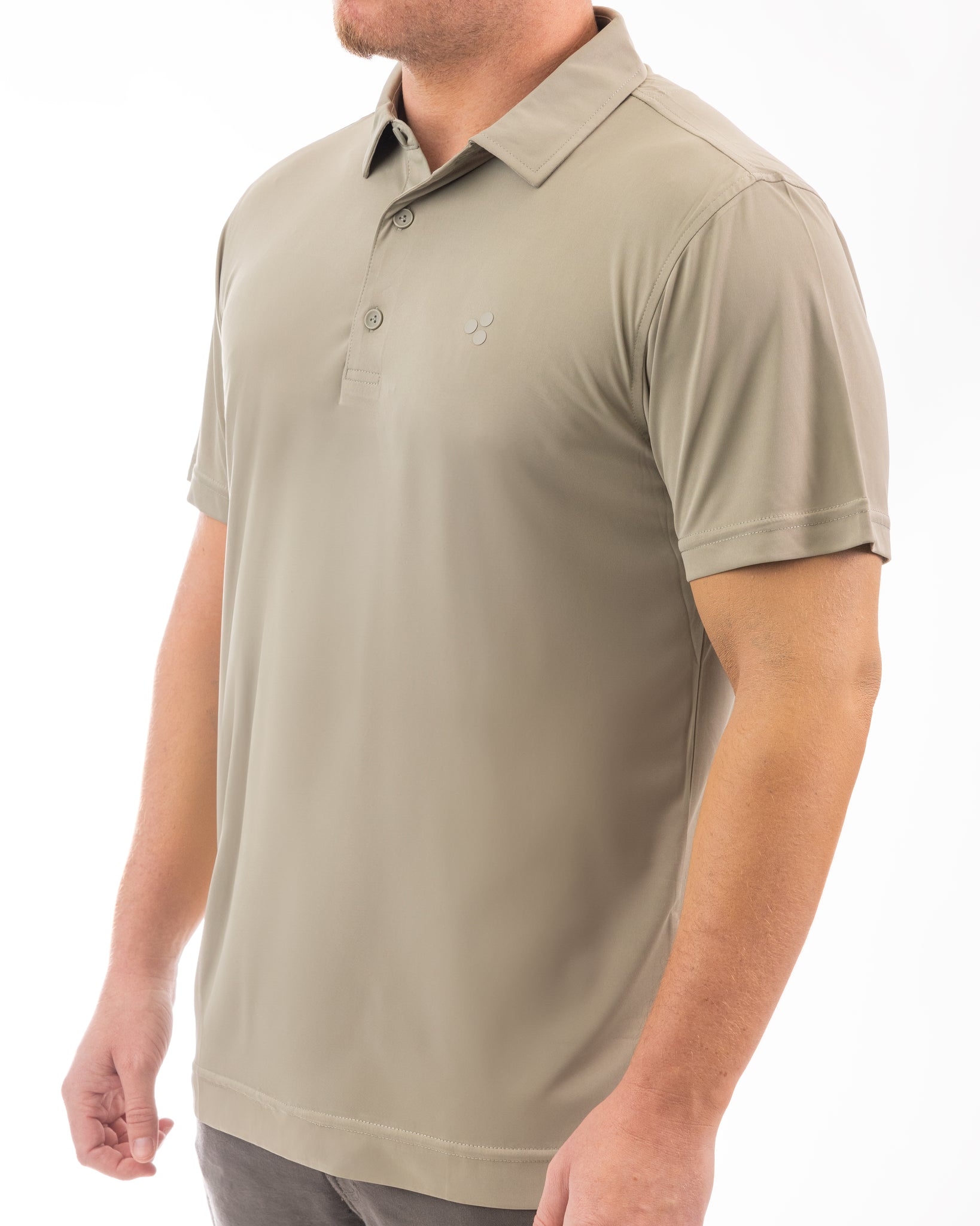 This is a high performing golf polo with a tan color to it. It’s got 4-way stretch, breathable, moisture wicking, uv protected and more.