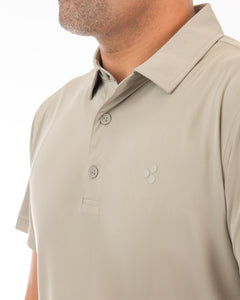 This is a high performing golf polo with a tan hue to it. It’s got 4-way stretch, breathable, moisture wicking, uv protected and more.