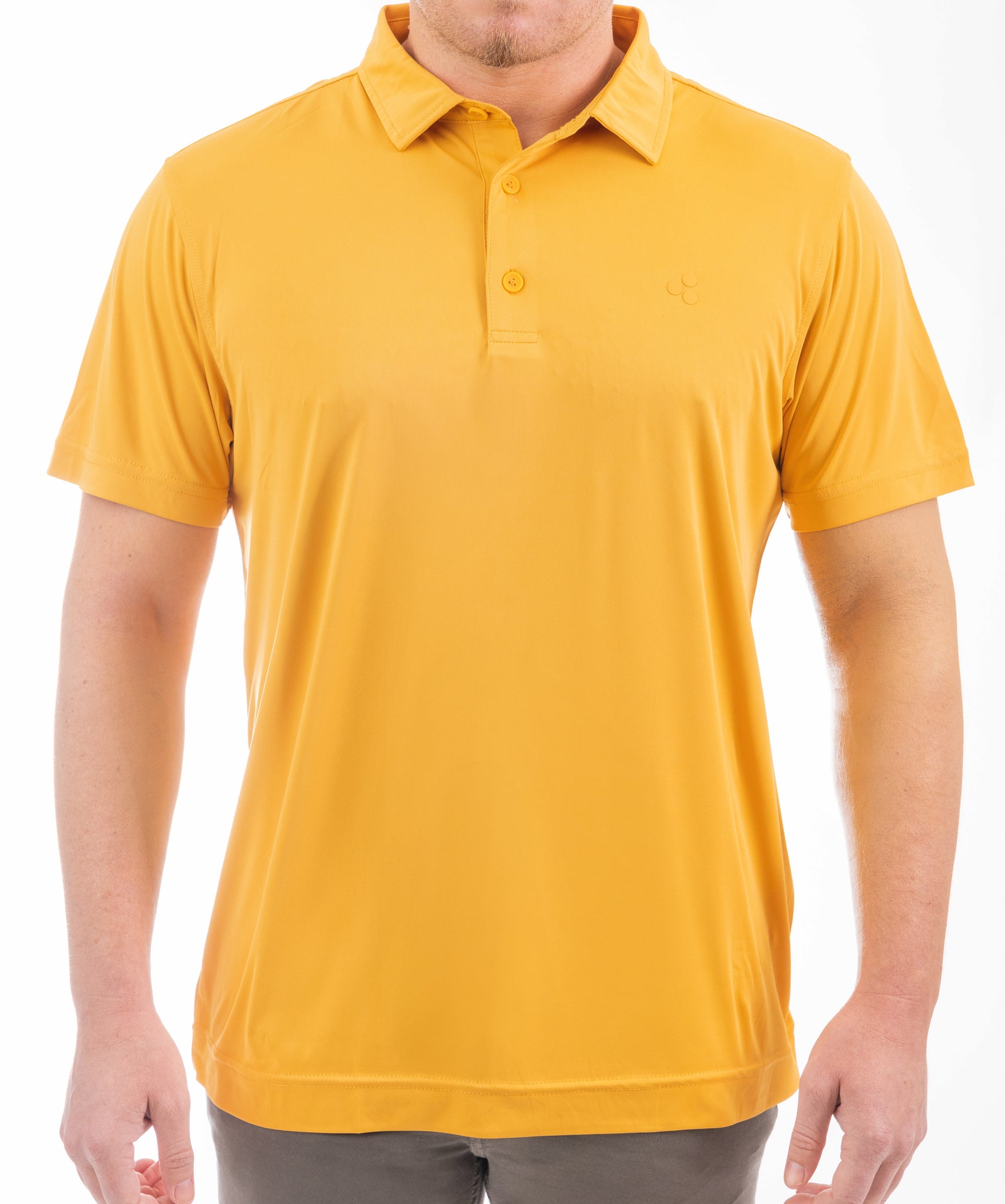 This golf polo has a golden-yellow color to it. It’s got 4-way stretch, it’s breathable, uv protected and an athletic fit.