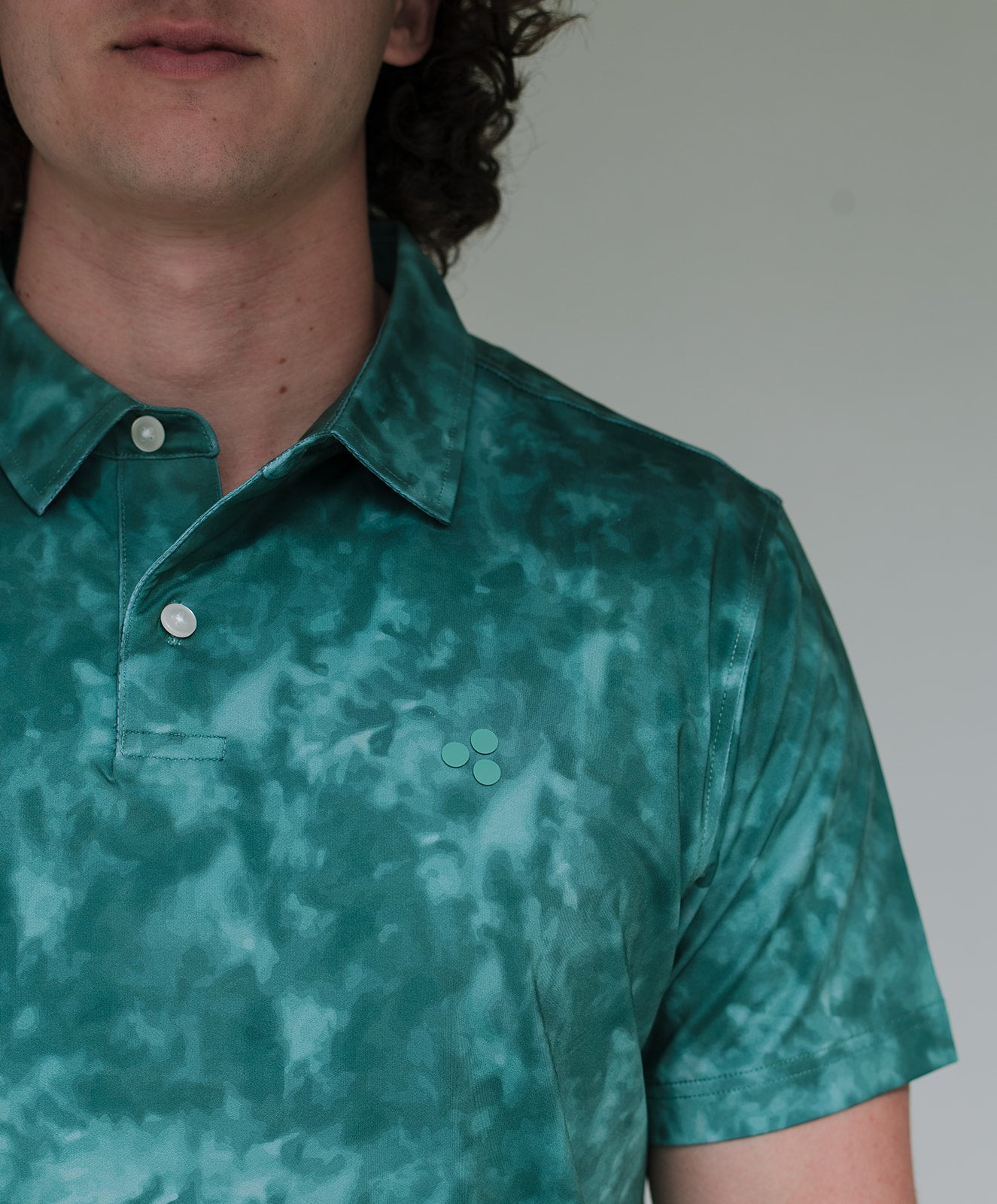 This golf polo is part of our “burn” series. The pattern is a mix between tie-dye and a burnt object. It comes in 3 colors and is moisture wicking, breathable, 4-way stretch and has an athletic fit. 