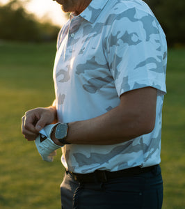 Golf polo with white camp pattern. This polo is breathable, stretchy, moisture wicking, and has an athletic fit. 