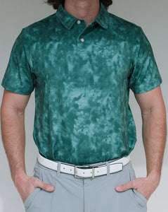 This golf polo is part of our “burn” series. The pattern is a mix between tie-dye and a burnt object. It comes in 3 colors and is moisture wicking, breathable, 4-way stretch and has an athletic fit. 